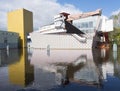 Reflections in canal of groninger museum in groningen