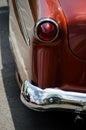 Reflections in chrome details of of exterior of a classic car -