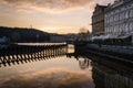 Reflections of the city on the Moldava river at sunset, Prague, Czech Republic