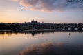 Reflections of the city on the Moldava river at sunset, Prague, Czech Republic