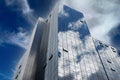 Reflections of clouds in the glass facade of a skyscraper Royalty Free Stock Photo