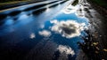 Reflections of Clouds on a Wet Road Surface Royalty Free Stock Photo