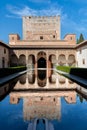 Reflections of Comares Tower in the Alhambra\'s central pool Royalty Free Stock Photo