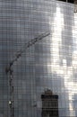 Reflections of crane at building site, milan Royalty Free Stock Photo