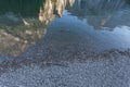 Reflections of the Dolomite mountains on the Braies lake