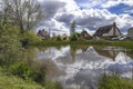 Reflections in the duck pond in the village of Bacton in Suffolk Royalty Free Stock Photo