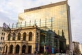 Reflections of early morning sky in the windows of Novotel Hotel in old town of Bucharest, Romania, 2020