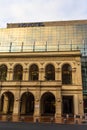 Reflections of early morning sky in the windows of Novotel Hotel in old town of Bucharest, Romania, 2020