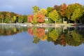 Reflections of Fall Colors on a Tranquil Lake