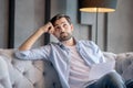 Thinking sad man sitting with a document in his hand. Royalty Free Stock Photo