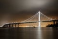 Reflections of fog and water on the Bay Bridge eastern span on a summer night. Royalty Free Stock Photo