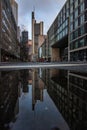 Reflections in Frankfurt am Main. Great reflection in puddles. The city, skyscrapers and streets are reflected in the water