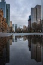 Reflections in Frankfurt am Main. Great reflection in puddles. The city, skyscrapers and streets are reflected in the water Royalty Free Stock Photo