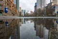 Reflections in Frankfurt am Main. Great reflection in puddles. The city, skyscrapers and streets are reflected in the water Royalty Free Stock Photo