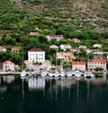 Reflections of the harbour and village in teh bay Royalty Free Stock Photo