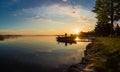 Morning Sunrise Fishing trip on a Boat at the Cottage Dock in Ontario Canada Royalty Free Stock Photo