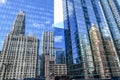 reflections of the large city skyline skyscrapers in the office building windows