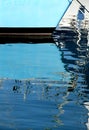 Reflections of the masts of a sailboat Royalty Free Stock Photo