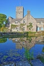 Reflections of Mill Pond cottages and St Mary`s Church in Church Hill, Swanage Royalty Free Stock Photo