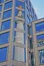 Reflections of the Monument to the great fire in London in the financial district of the City of London Royalty Free Stock Photo