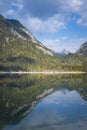 Reflections of mountains in lake plansee in spring at austria Royalty Free Stock Photo