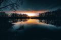 Reflections off a vivid Sunset sky over a Lake Royalty Free Stock Photo