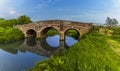 Reflections of the old bridge at Bodiam, Sussex on the river Rother Royalty Free Stock Photo