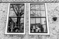 Reflections in old fashioned traditional window in Amsterdam, The Netherlands