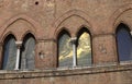 reflections in the old Windows called Bifore in the old medieval Italian palace Royalty Free Stock Photo