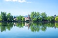 Reflections of the park and the houses around the lake