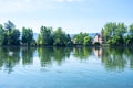 Reflections of the park and the houses in the lake