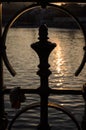 Reflections on the river through a fence at sunset, Prague, Czech Republic