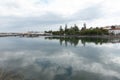 Reflections in the river running through the city