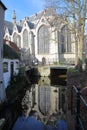 Reflections of Sint Janskerk church on a canal, Gouda, South_Holland, Netherlands