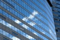 Reflections of sky and clouds in the windows of a modern business building. Low angle view. Business District Moscow City. Close-