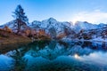 Reflections of snow capped mountains in a blue icy lake in the mountains Royalty Free Stock Photo