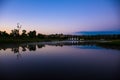 Reflections In Still Water Catfish Pond At Dawn