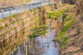 Reflections in stream next to roadway Royalty Free Stock Photo