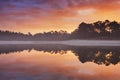 Reflections of sunrise at a quiet lake in The Netherlands Royalty Free Stock Photo