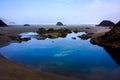 Reflections in tide pool water at Cannon Beach Royalty Free Stock Photo