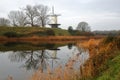 Reflections of a traditional windmill in the colorful countryside surrounding,Veere