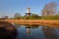 Reflections of a traditional windmill in the colorful countryside surrounding Veere