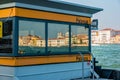 Reflections of venetian buildings in windows of vaporetto station in Venice, Italy Royalty Free Stock Photo