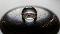 Reflections are visible within the droplet creating a bright star Royalty Free Stock Photo