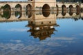 Reflections in the water. Old chinese bridge. The ancient Shuanglong Bridge Seventeen Span Bridge Jianshui, Yunnan, China Royalty Free Stock Photo