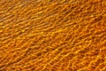 Reflections on the water surface in the river. Background of corrugated pattern of clean water sand. View from above. Abstract Royalty Free Stock Photo