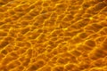 Reflections on the water surface in the river. Background of corrugated pattern of clean water sand. View from above. Abstract Royalty Free Stock Photo