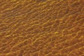 Reflections on the water surface in the river. Background of corrugated pattern of clean water sand. View from above. Abstract Royalty Free Stock Photo