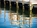 Reflections of wooden posts at Baltimore Harbor