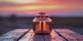 Reflective Copper Jar on Wooden Table at Sunset. Royalty Free Stock Photo